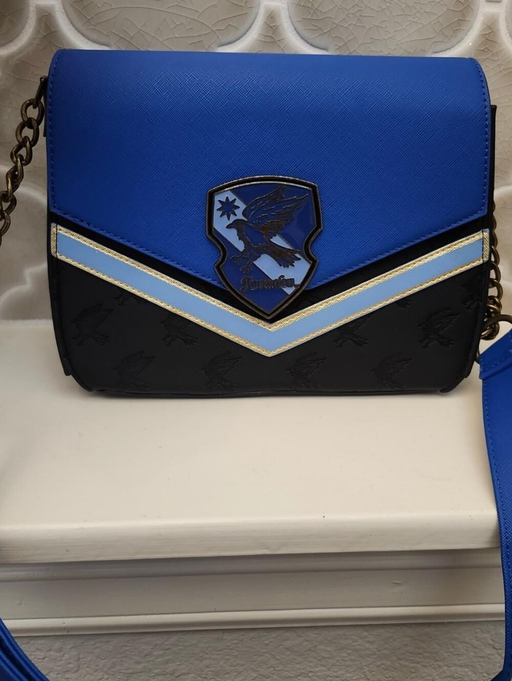 Harry Potter Loungefly Ravenclaw purse with ravenclaw crescent on the front.